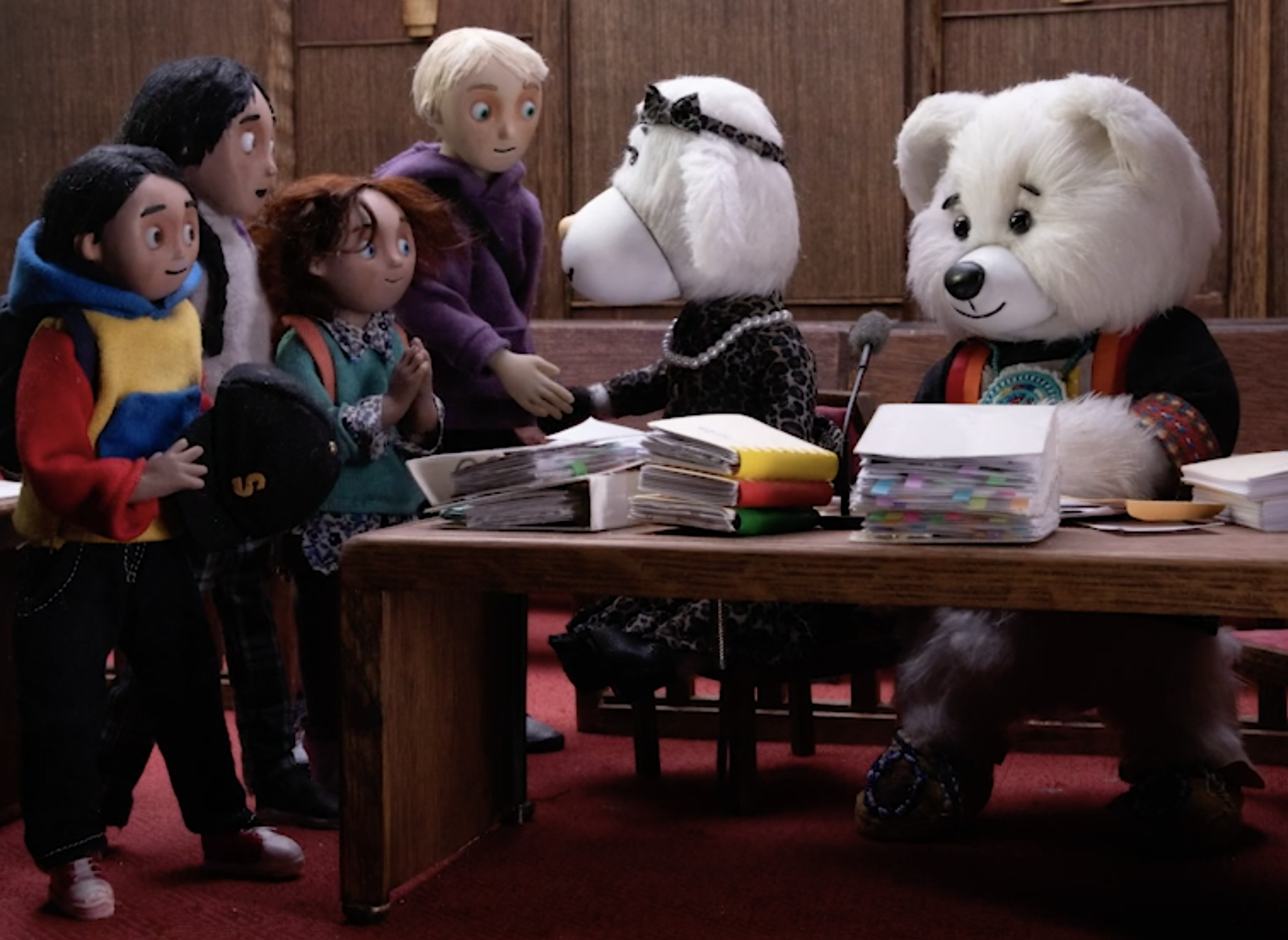 Movie still of Spirit Bear, Cindy the Ship and friends at the Tribunal