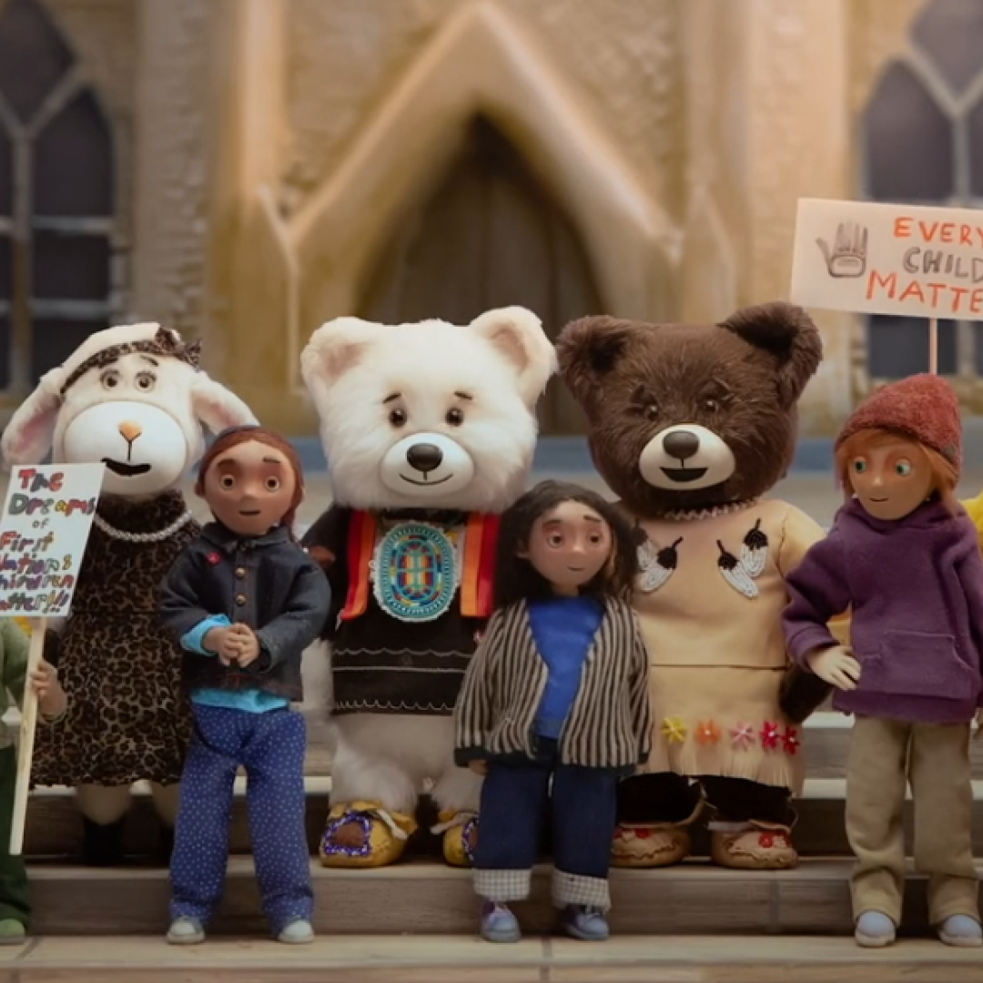 Still from Spirit Bear movie showing kids and bears on Parliament Hill